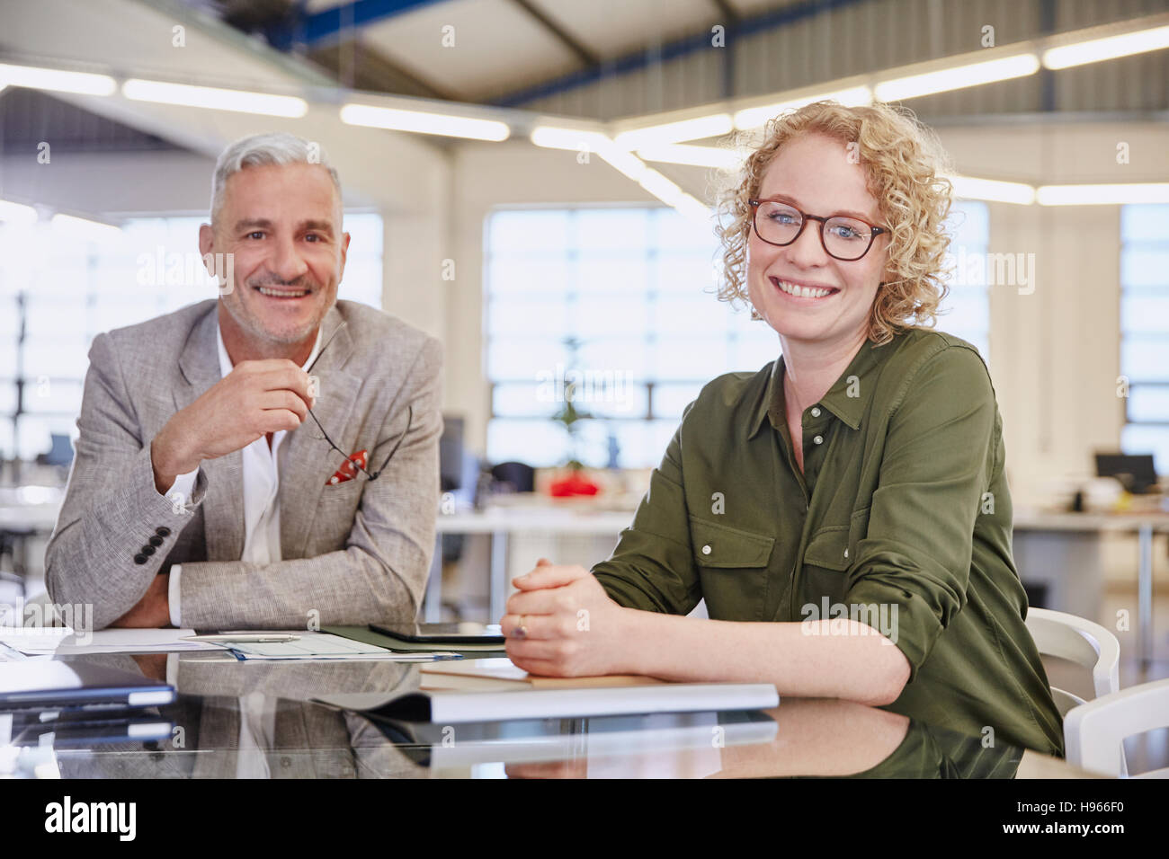 Portrait smiling business people in meeting Stock Photo - Alamy
