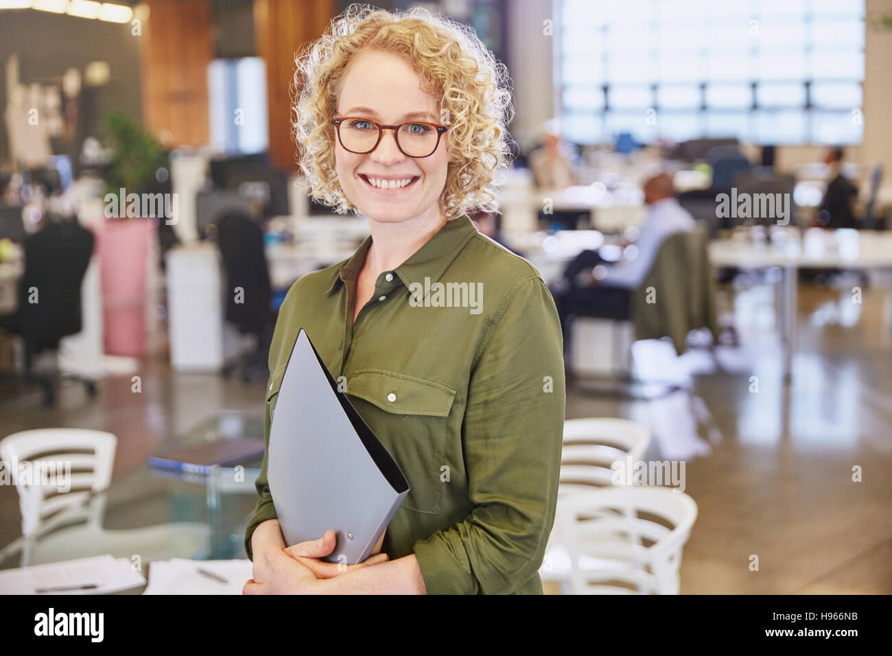 Portrait smiling businesswoman in office Stock Photo - Alamy