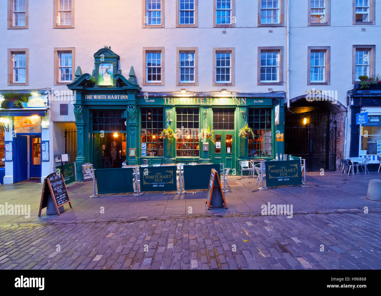 UK, Scotland, Lothian, Edinburgh, Grassmarket Square, Twilight view of the White Hart Inn. Stock Photo