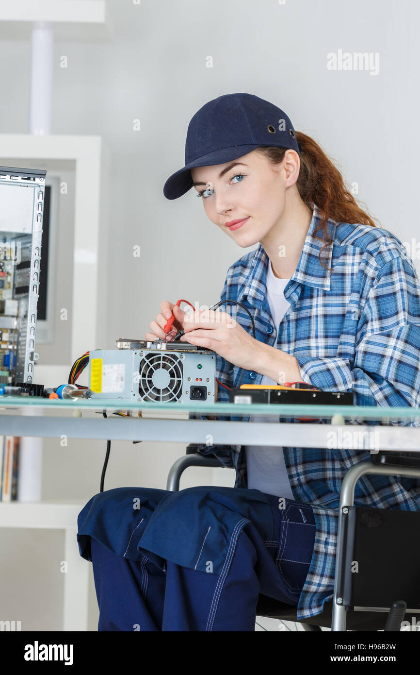 woman fixing a computer at work Stock Photo Alamy