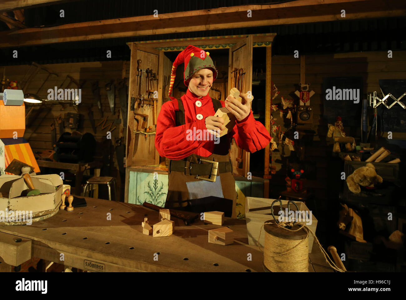 Elf Conker works in the Toy Factory during the opening day of LaplandUK, a village with an ice rink, reindeer and snowy landscapes in Ascot, Berkshire. Stock Photo