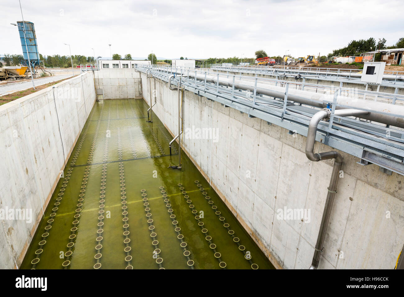 Modern urban wastewater treatment plant. Water cleaning facility outdoors. Water purification is the process of removing undesirable chemicals, suspen Stock Photo