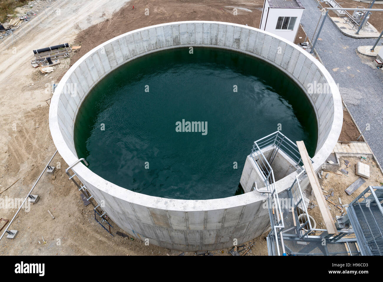 Modern urban wastewater treatment plant. Water cleaning facility outdoors. Water purification is the process of removing undesirable chemicals, suspen Stock Photo
