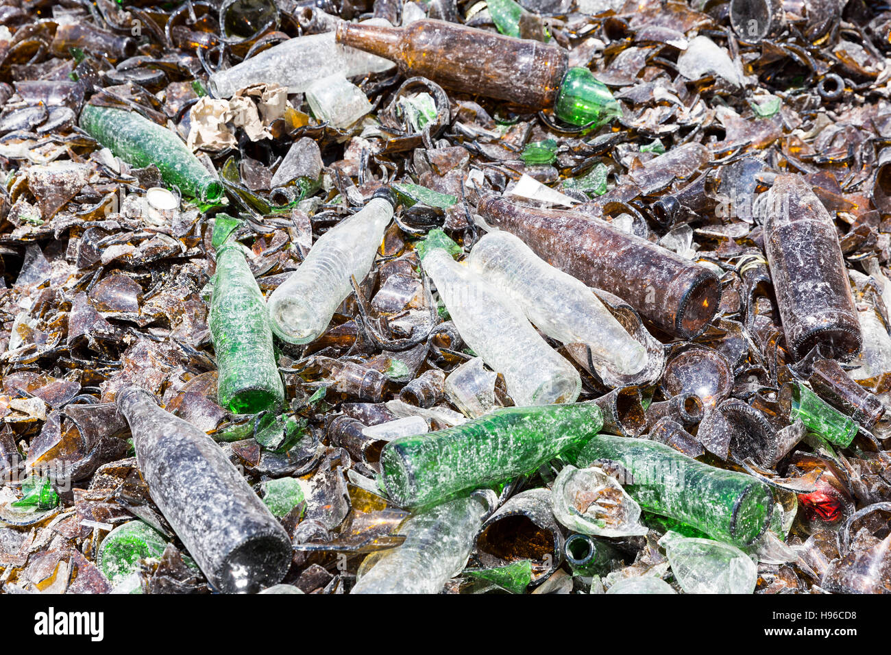 Glass waste for recycling in a recycling facility. Different glass