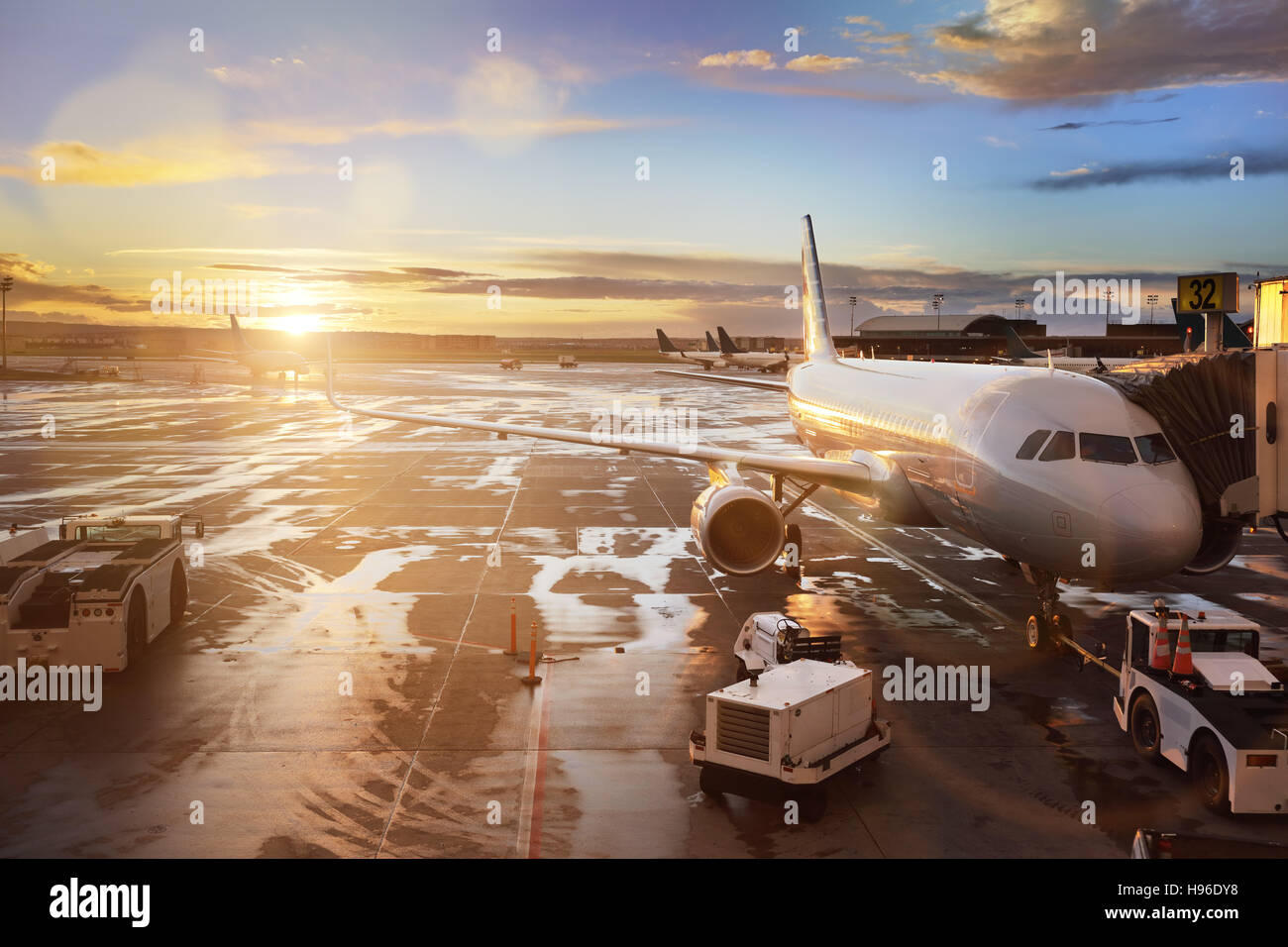 Airplane at terminal gate in international airport Stock Photo