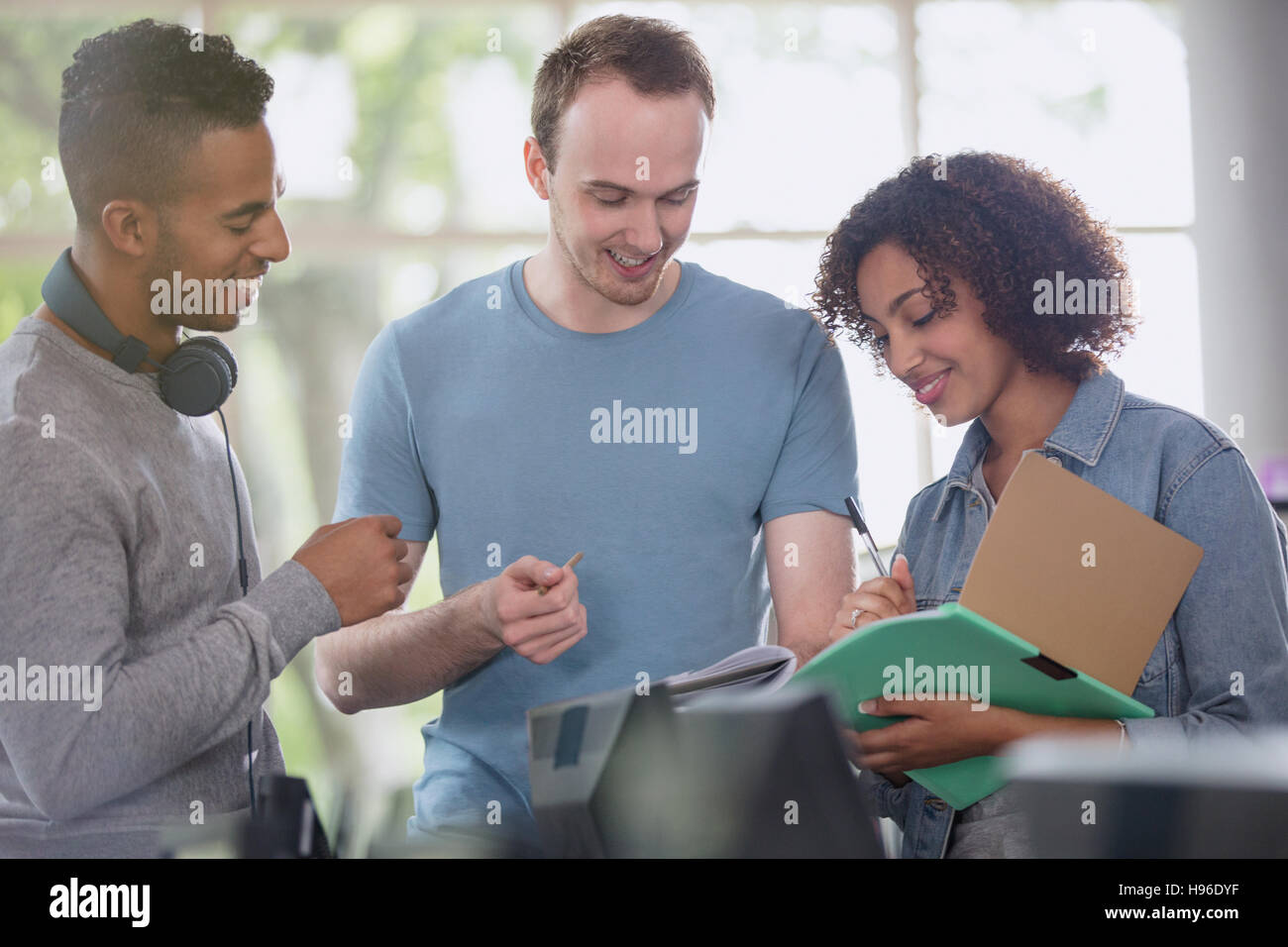 College students discussing homework Stock Photo