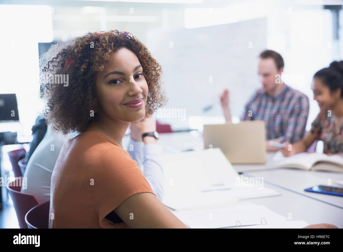Portrait smiling female college student studying Stock Photo - Alamy