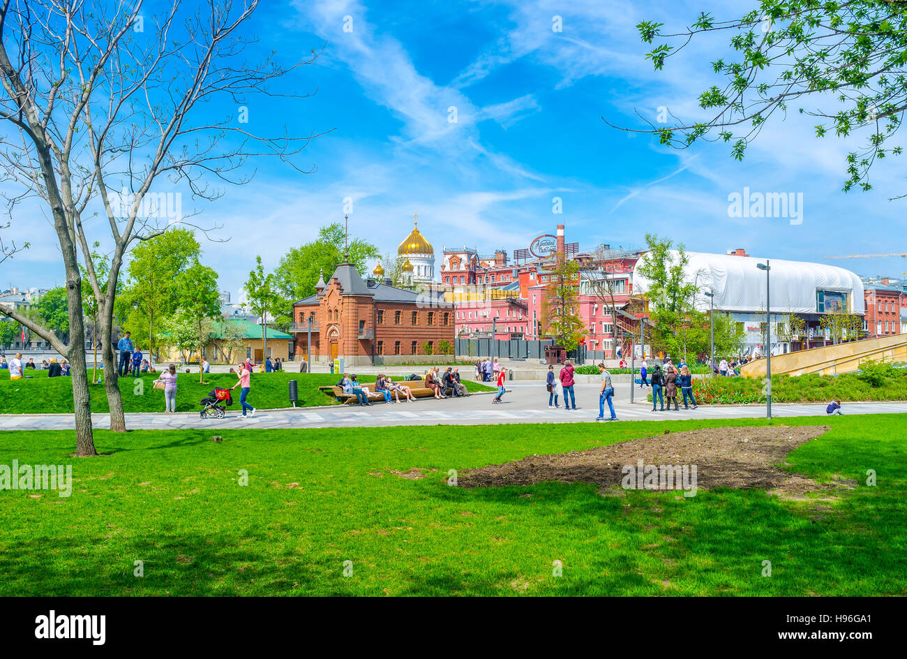 People relax in Muzeon Park, also known as park of Fallen Statues Stock Photo