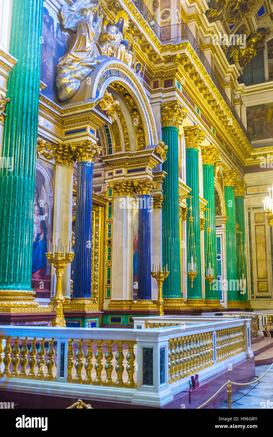 The iconostasis of St Isaac's Cathedral is framed by semiprecious stone columns, green malachite and blue lazurite Stock Photo