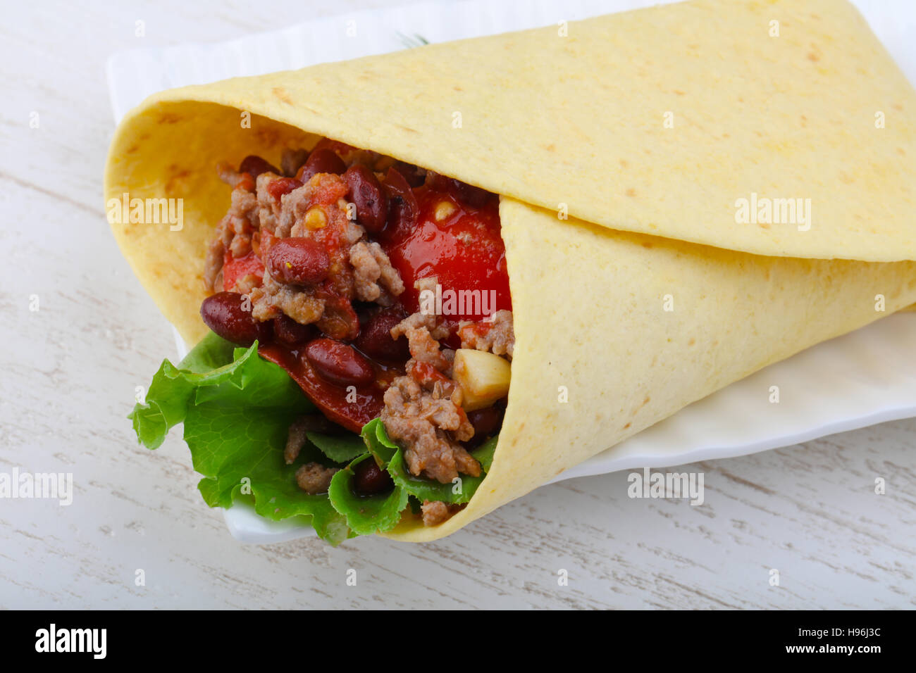 Burrito With Beef Salad Beans And Sauce Stock Photo Alamy burrito-with-beef-salad-beans-and-sauce-stock-photo-alamy