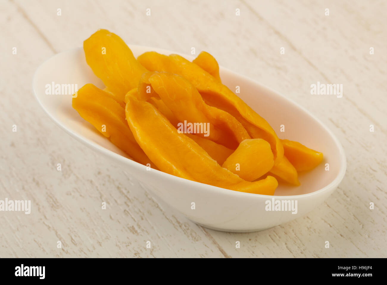 Dry mango chips heap in the bowl Stock Photo Alamy