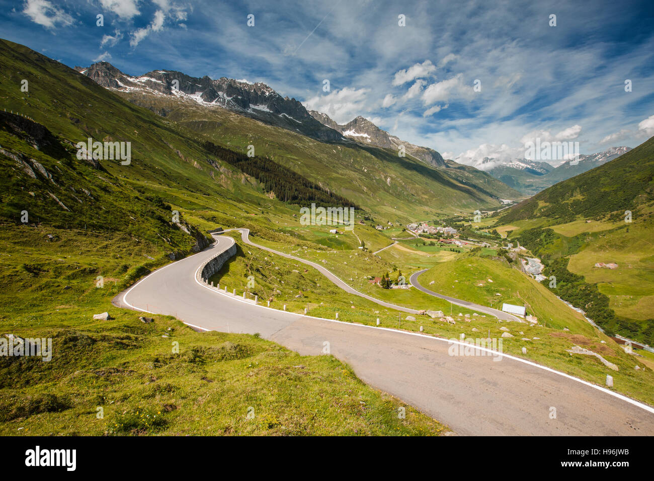 View of road from Furka pass, Realp city below Stock Photo