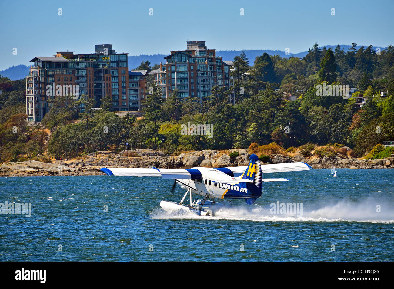 A rear view of a Harbor Air floatplane taxing on the inner harbor in Victoria B.C. ready for take off Stock Photo