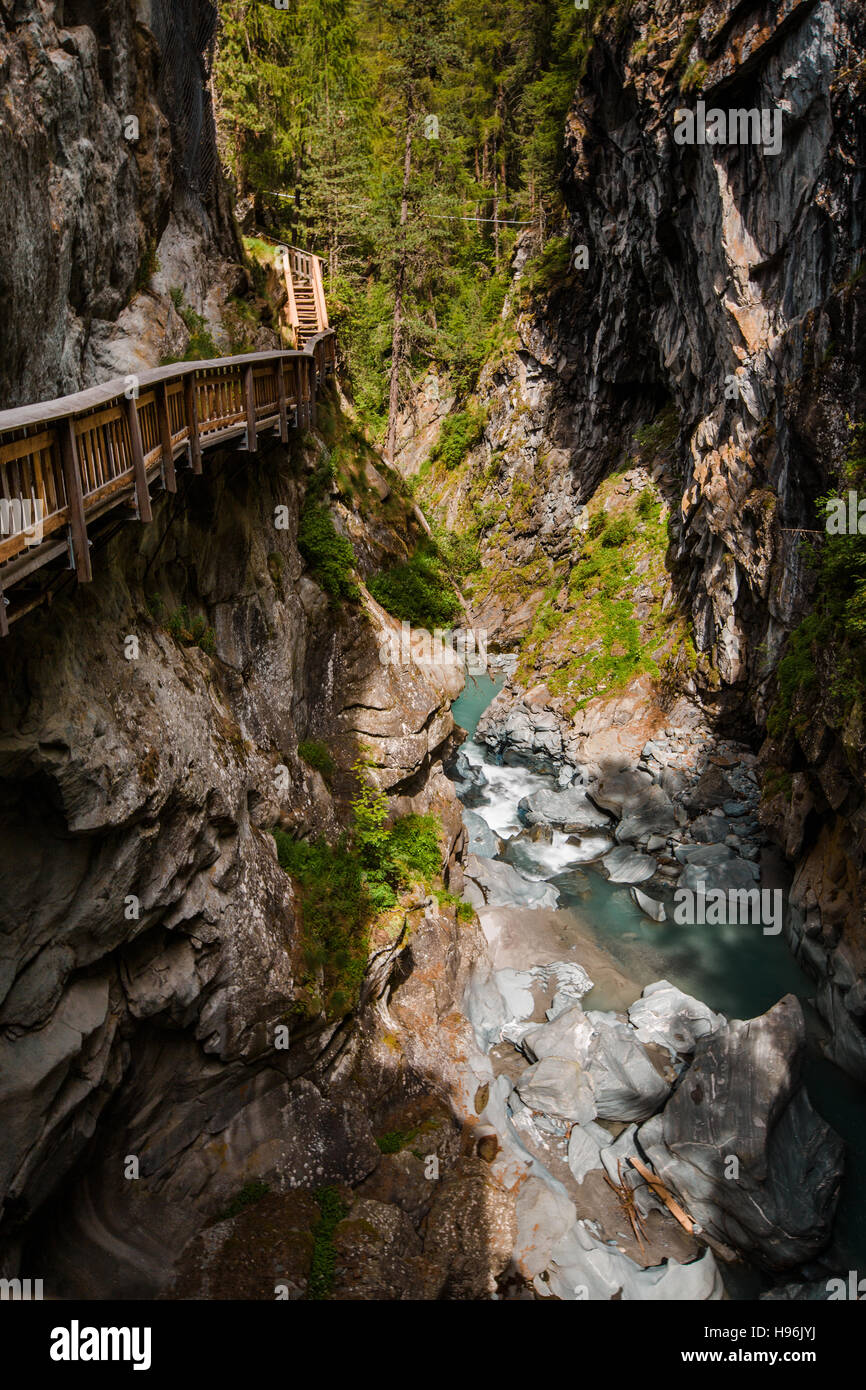 Vertical shot of path in Gorner Gorge with river Stock Photo