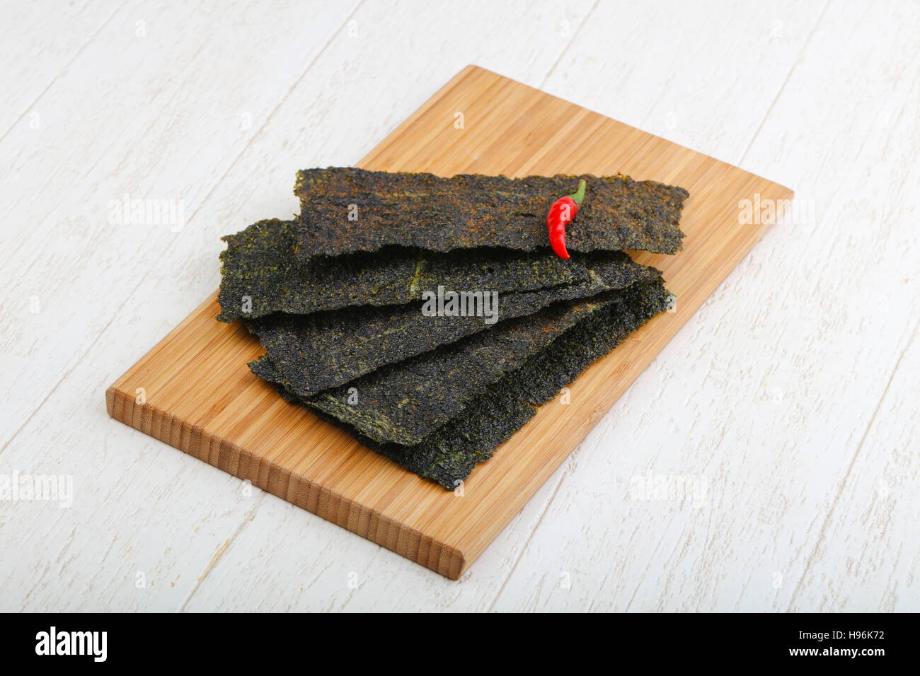 Spicy Nori seaweed sheets with pepper on wood Stock Photo Alamy