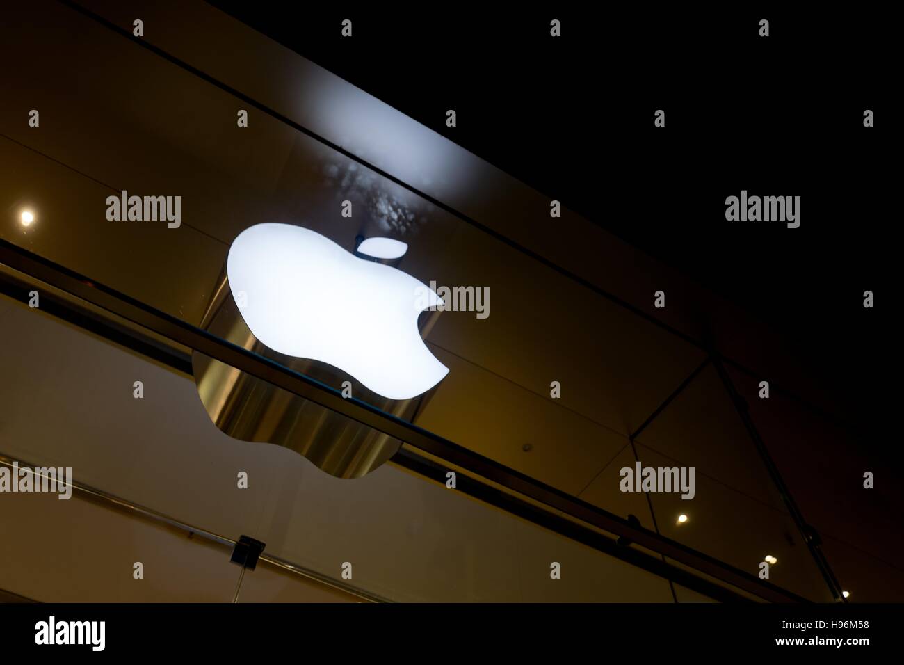 The light sign for the Apple Store as seen from the outside at night ...