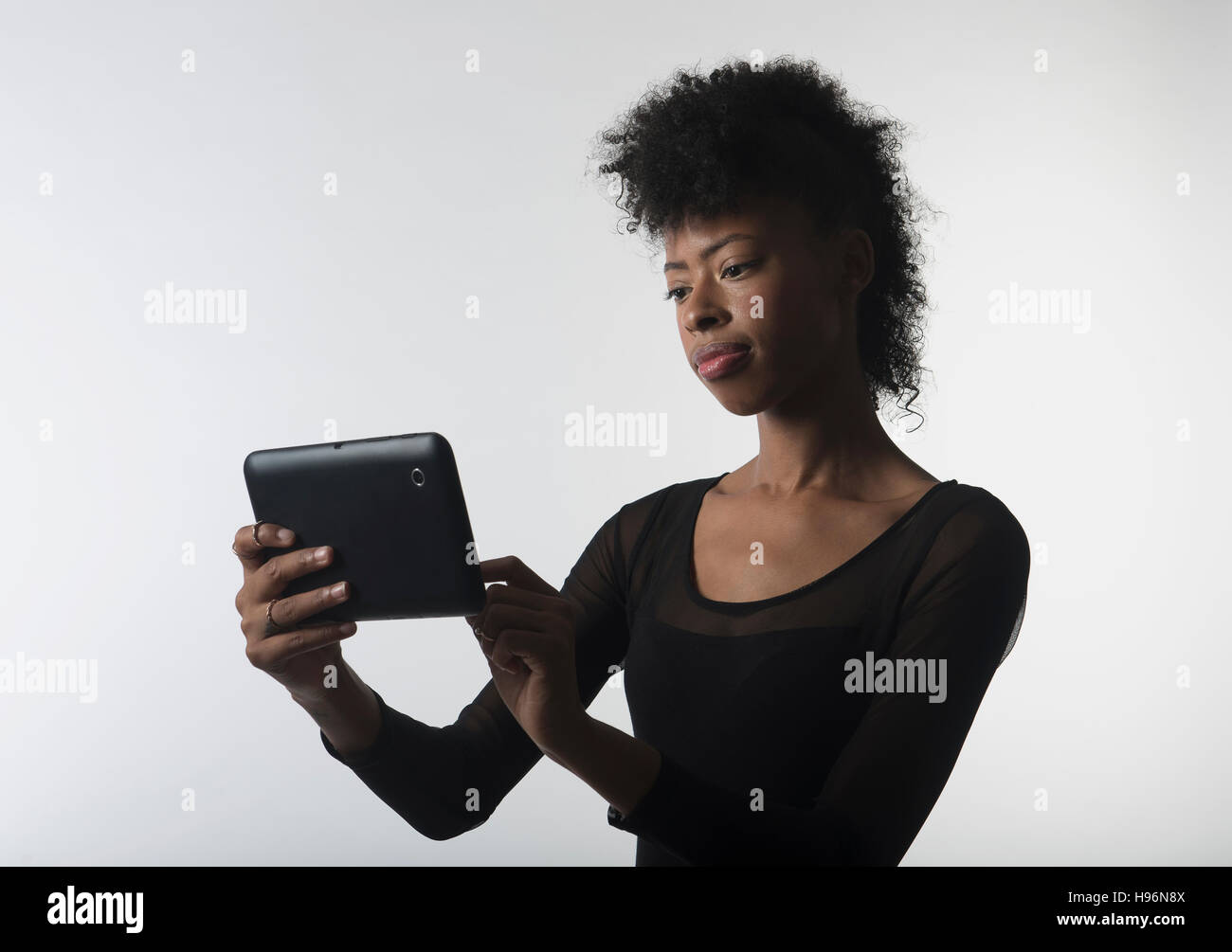 Young woman with digital tablet Stock Photo
