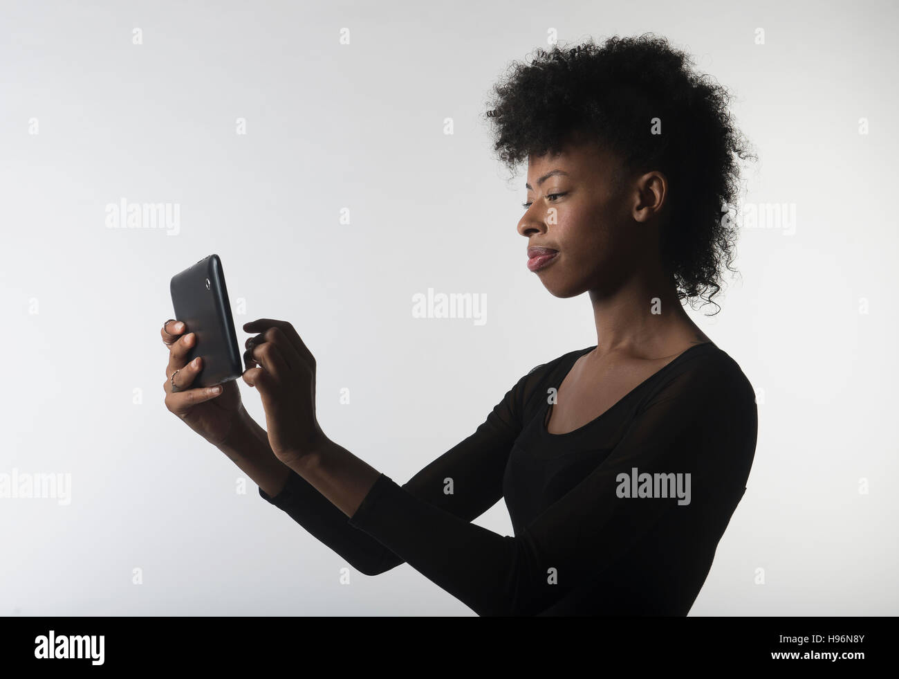 Young woman with digital tablet Stock Photo