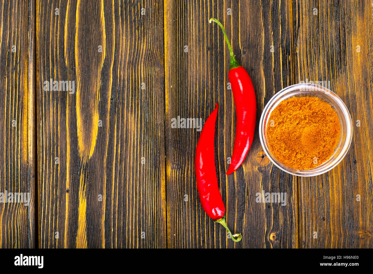 Red hot chilli peppers on wood. Studio Photo Stock Photo - Alamy