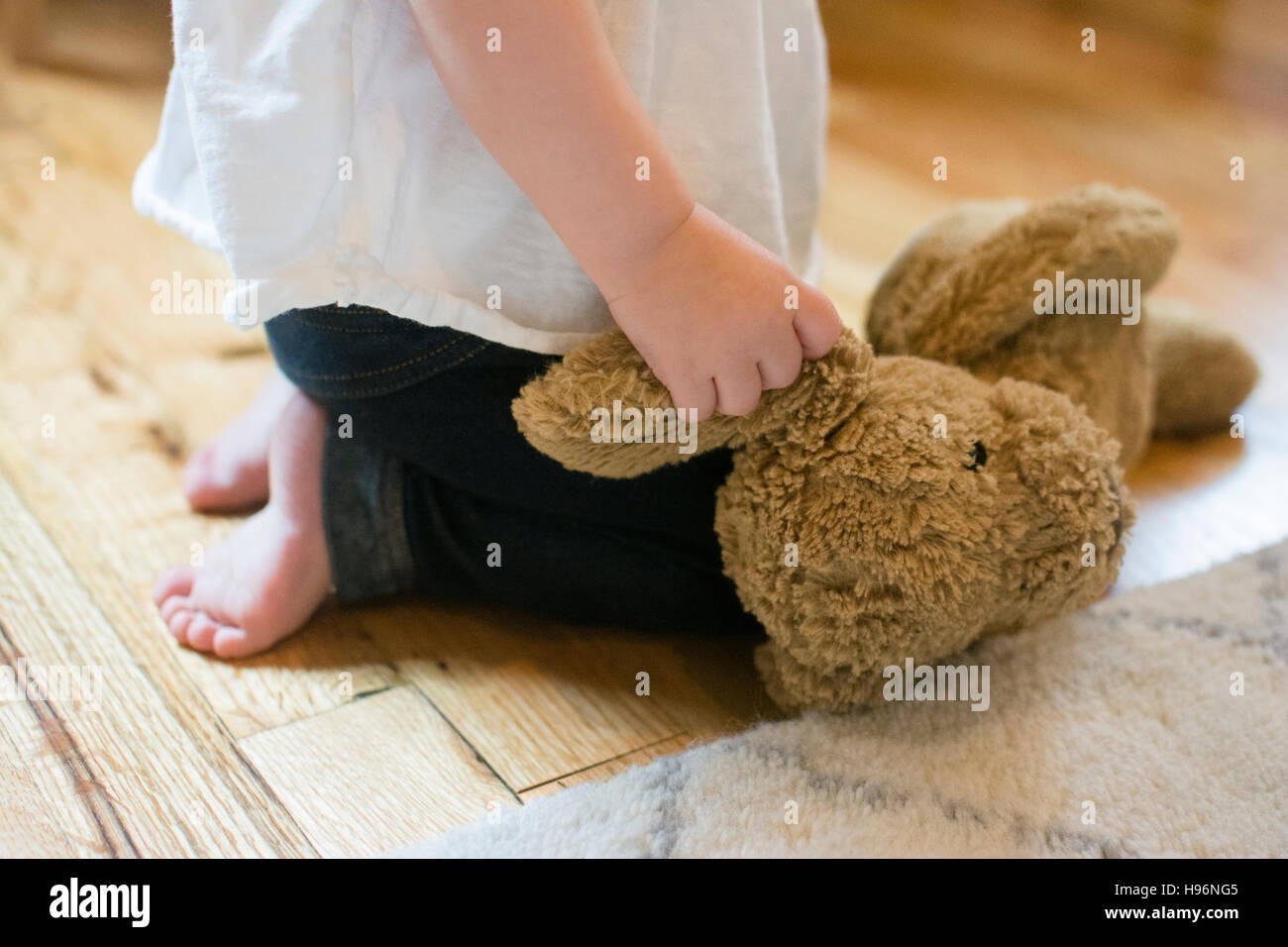 Barefoot girl kneeling hi-res stock photography and images - Alamy