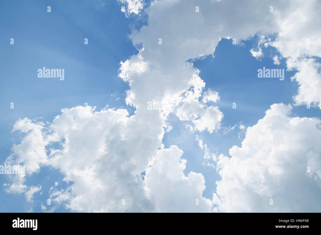 Sun rays shining through clouds Stock Photo - Alamy
