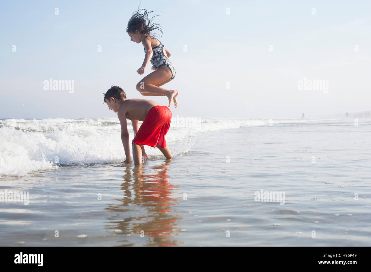 Children playing on beach Stock Photo