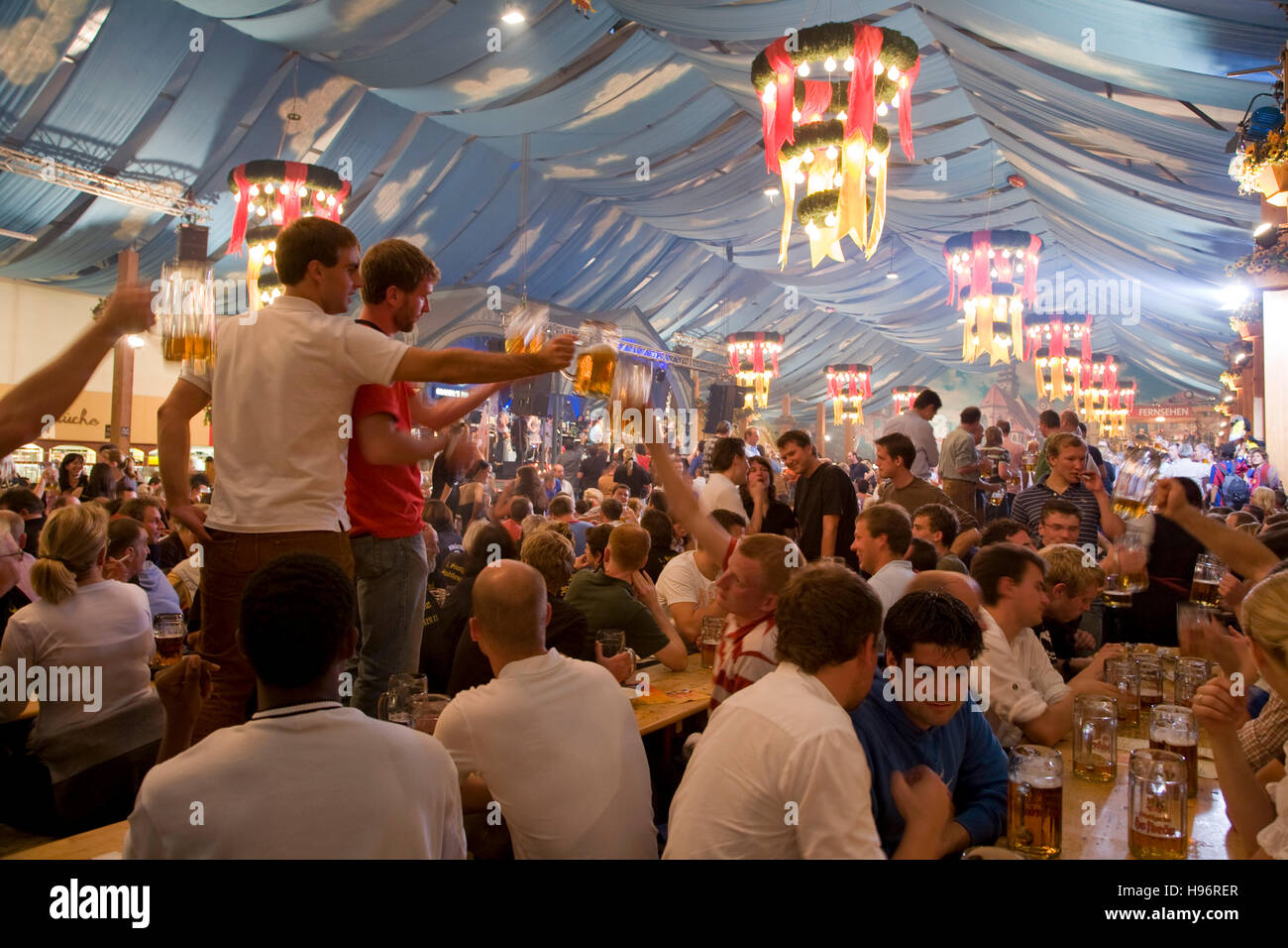 People drinking beer in a beer tent, Cannstatter Festival, Bad Cannstatt, Stuttgart, Baden-Wuerttemberg, Germany Stock Photo