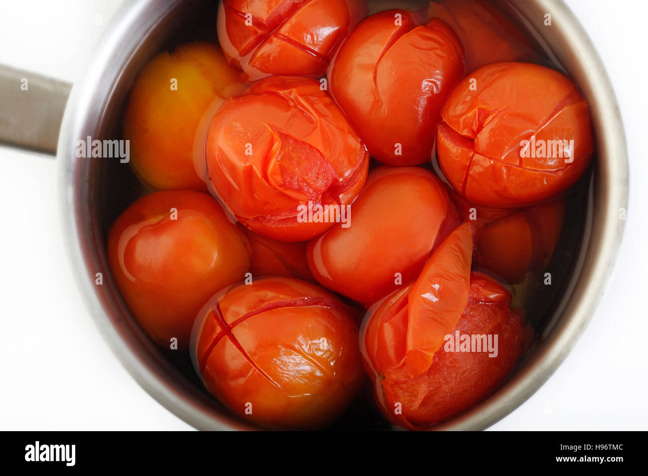 boiled tomato in pot Stock Photo