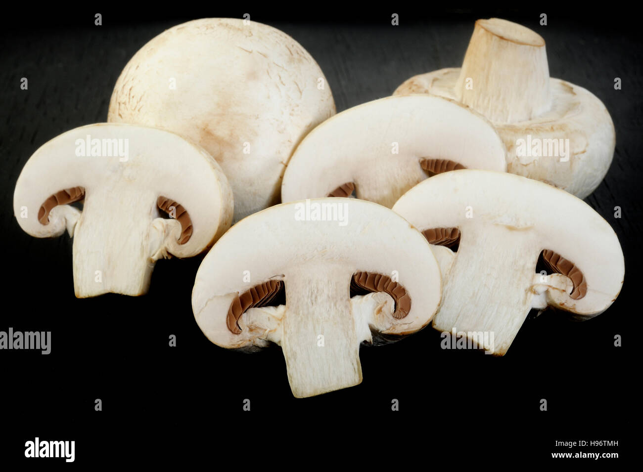 fresh champignon mushrooms on wooden background Stock Photo