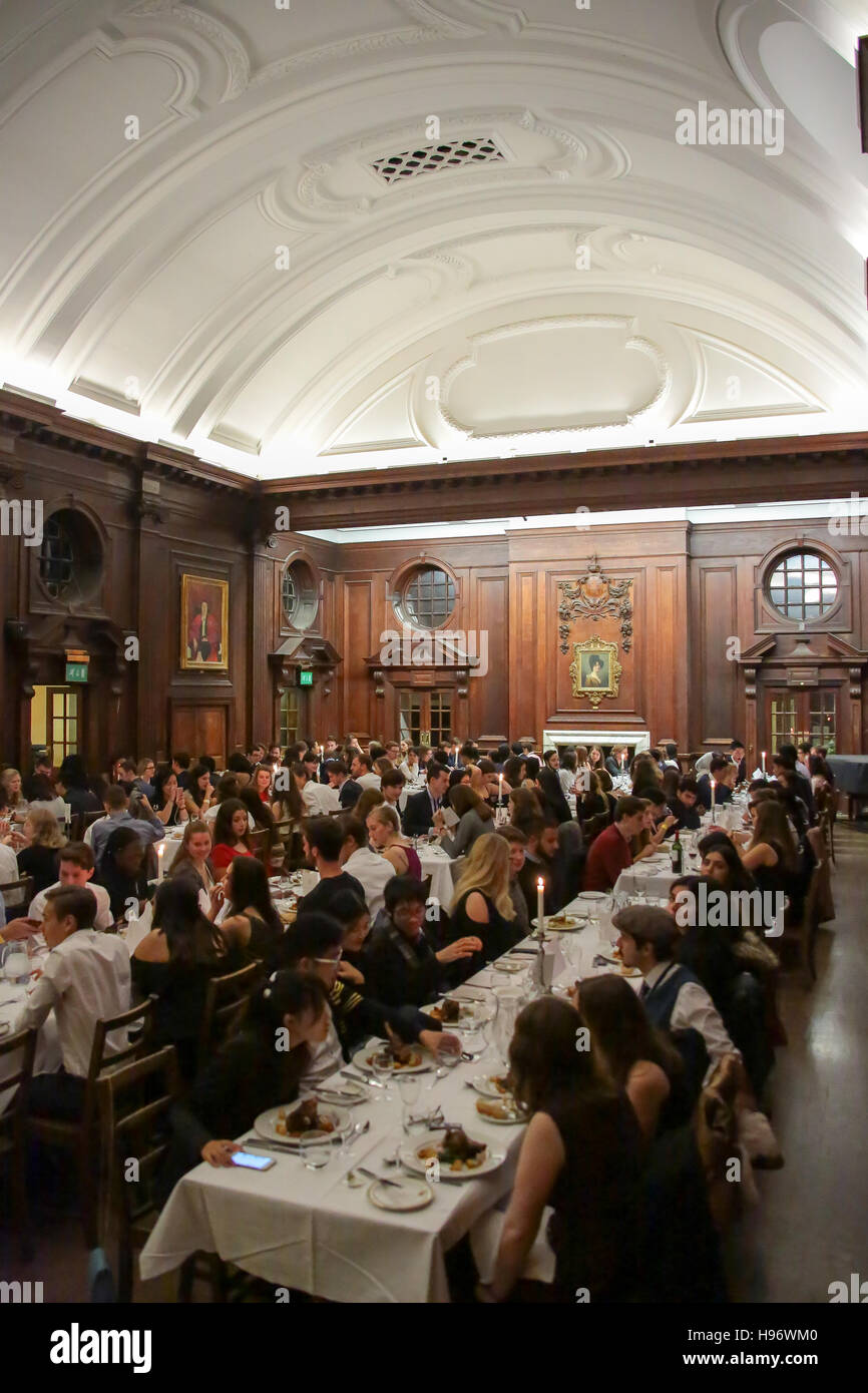 Students having dinner in the dining hall of Somerville College in Oxford. From a series of