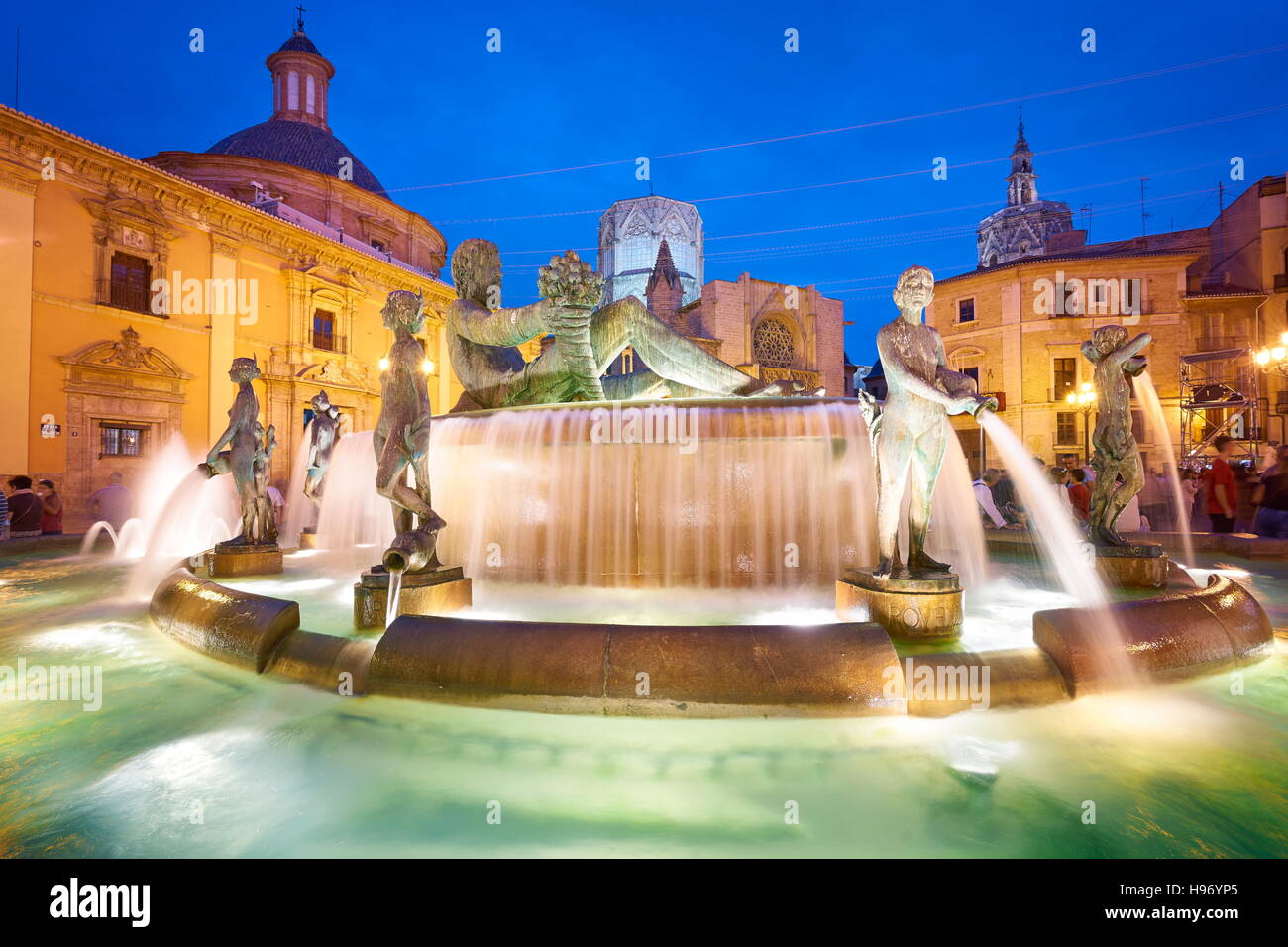 Turia fountain at evening, Plaza de la Virgen, Valencia old town, Spain Stock Photo