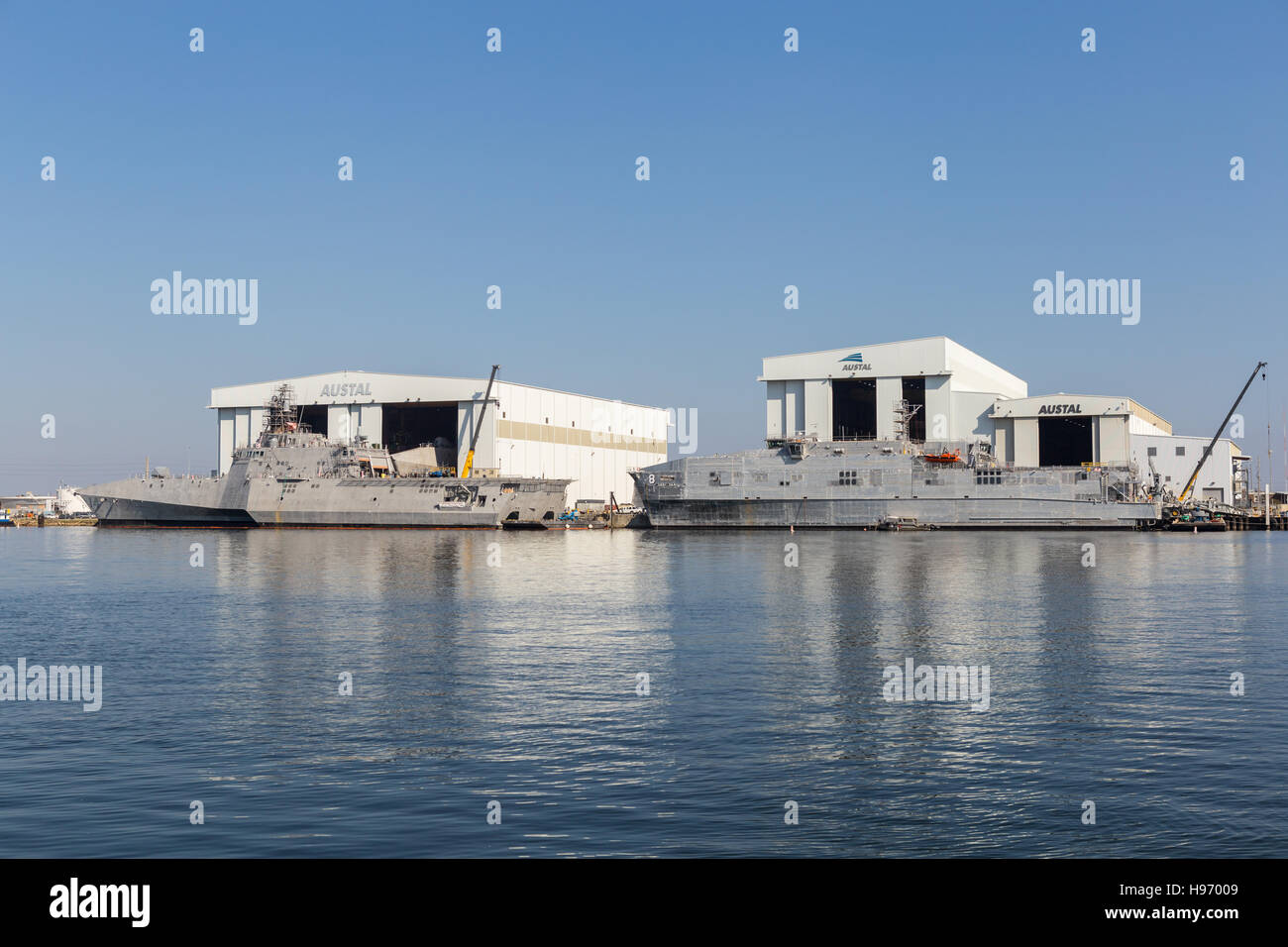 USS Manchester littoral combat ship and USNS Yuma expeditionary fast transport at the Austal Shipyard in Mobile, Alabama. Stock Photo