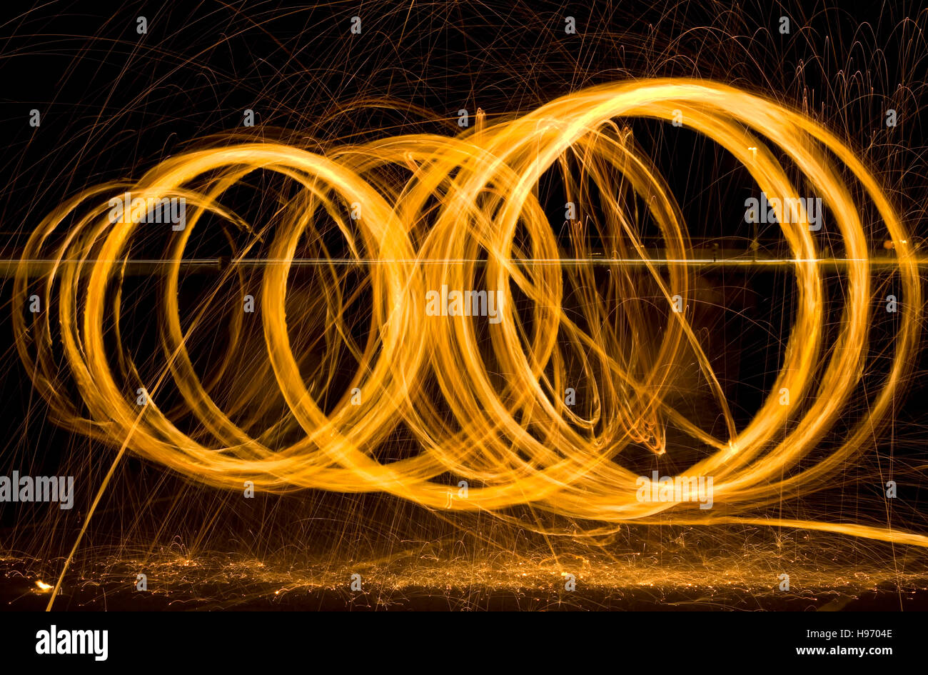 Round Light Painting Sparks at Night Stock Photo