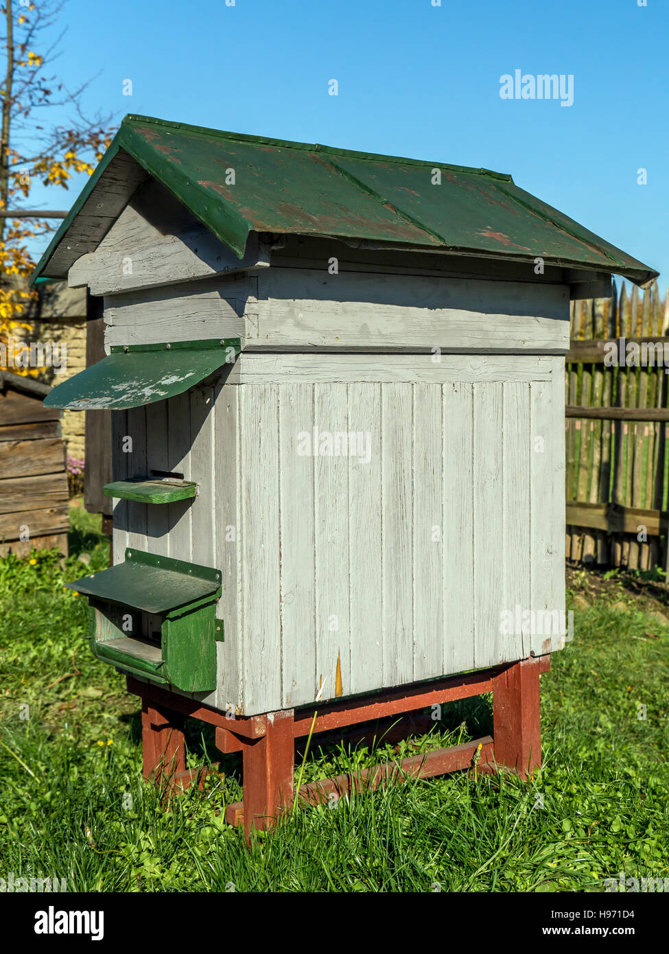 Old wooden bee hive in the garden Stock Photo