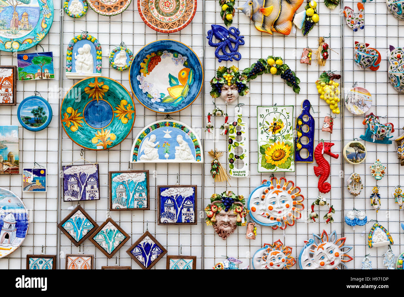 A collection of traditionally made ceramic artifacts on sale at a store