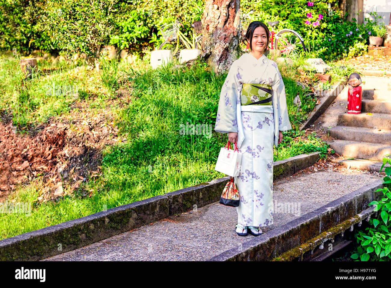 Kyoto, Japan - May 01, 2014: View of a Japanese girl wearing traditional Kimono. The kimono is a Japanese traditional garment Stock Photo