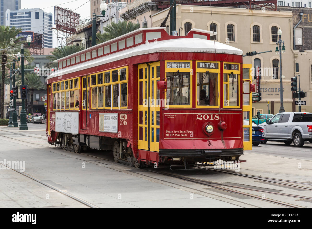 A northbound RTA Canal - Cemeteries line streetcar moves along Canal Street in New Orleans, Louisiana. Stock Photo