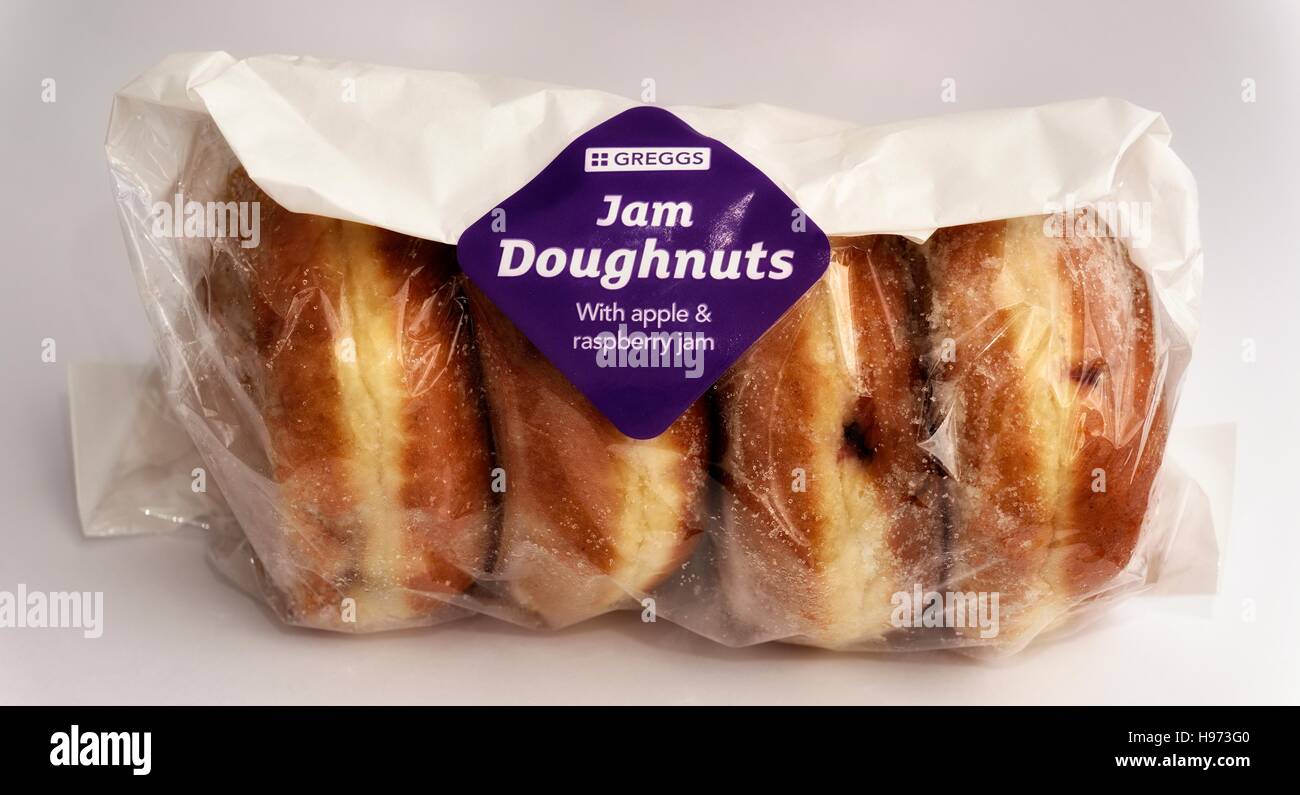 A pack of Greggs apple and raspberry jam doughnuts 4 pack Stock Photo