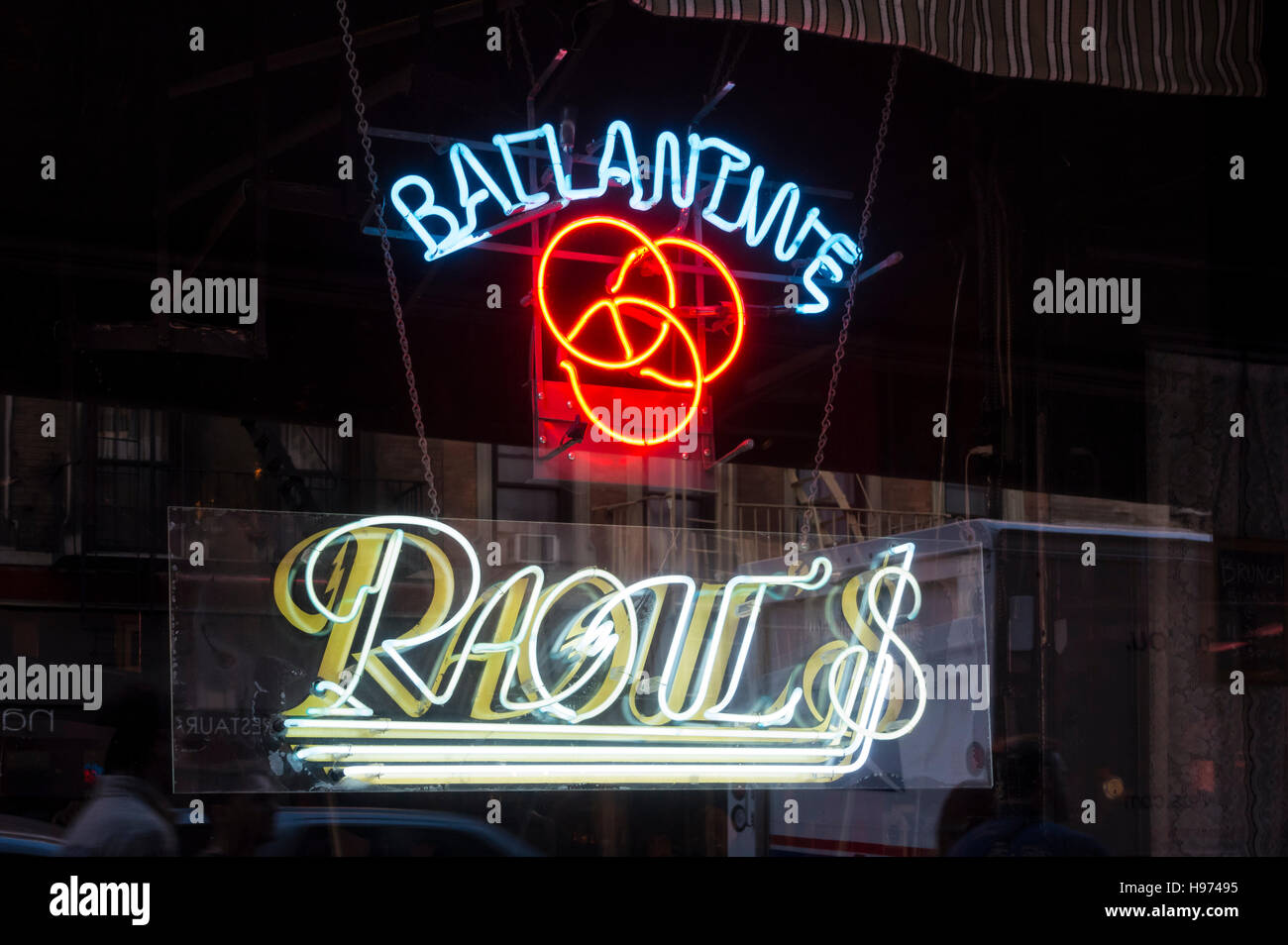Neon sign in the window of Raoul's restaurant bar in Soho, New York ...