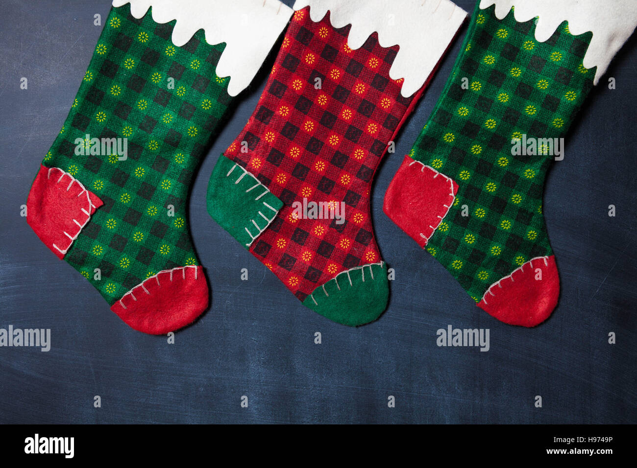 Christmas stocking on a blackboard background, xmas card Stock Photo