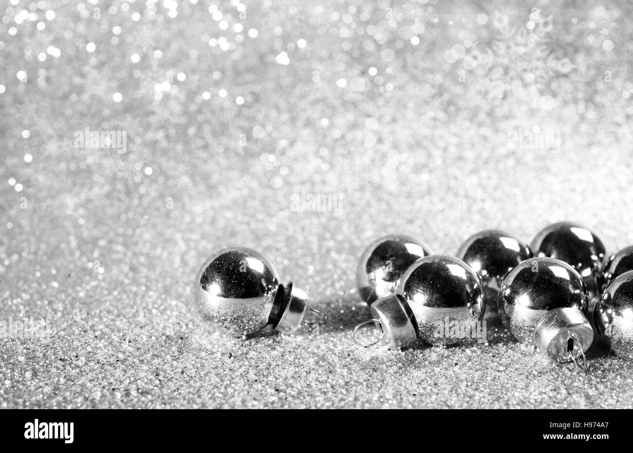 Silver christmas balls on shining glitter background Stock Photo