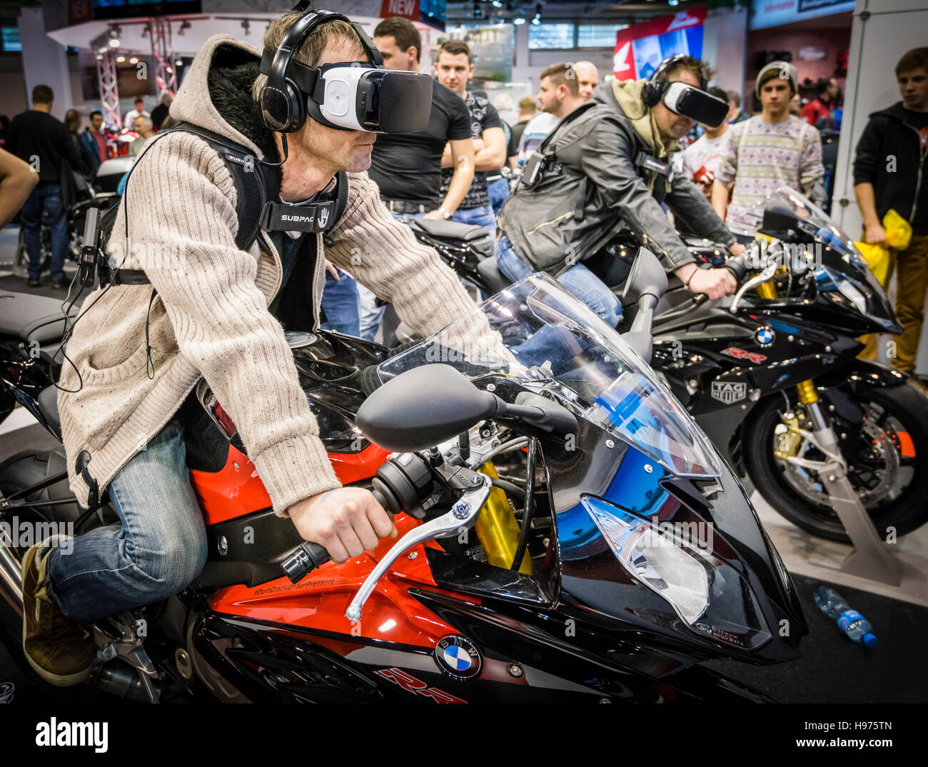 Zurich, Switzerland - 21 Feb 2016: Surrounded by other fairgoers, two men  wearing VR headsets are virtually riding motorbikes at the BMW stand of  Swiss Moto Zurich, Switzerland's largest motorcycle fair Stock Photo - Alamy