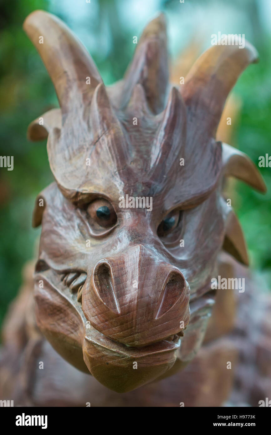 Wooden dragon's head statue staring at the camera Stock Photo