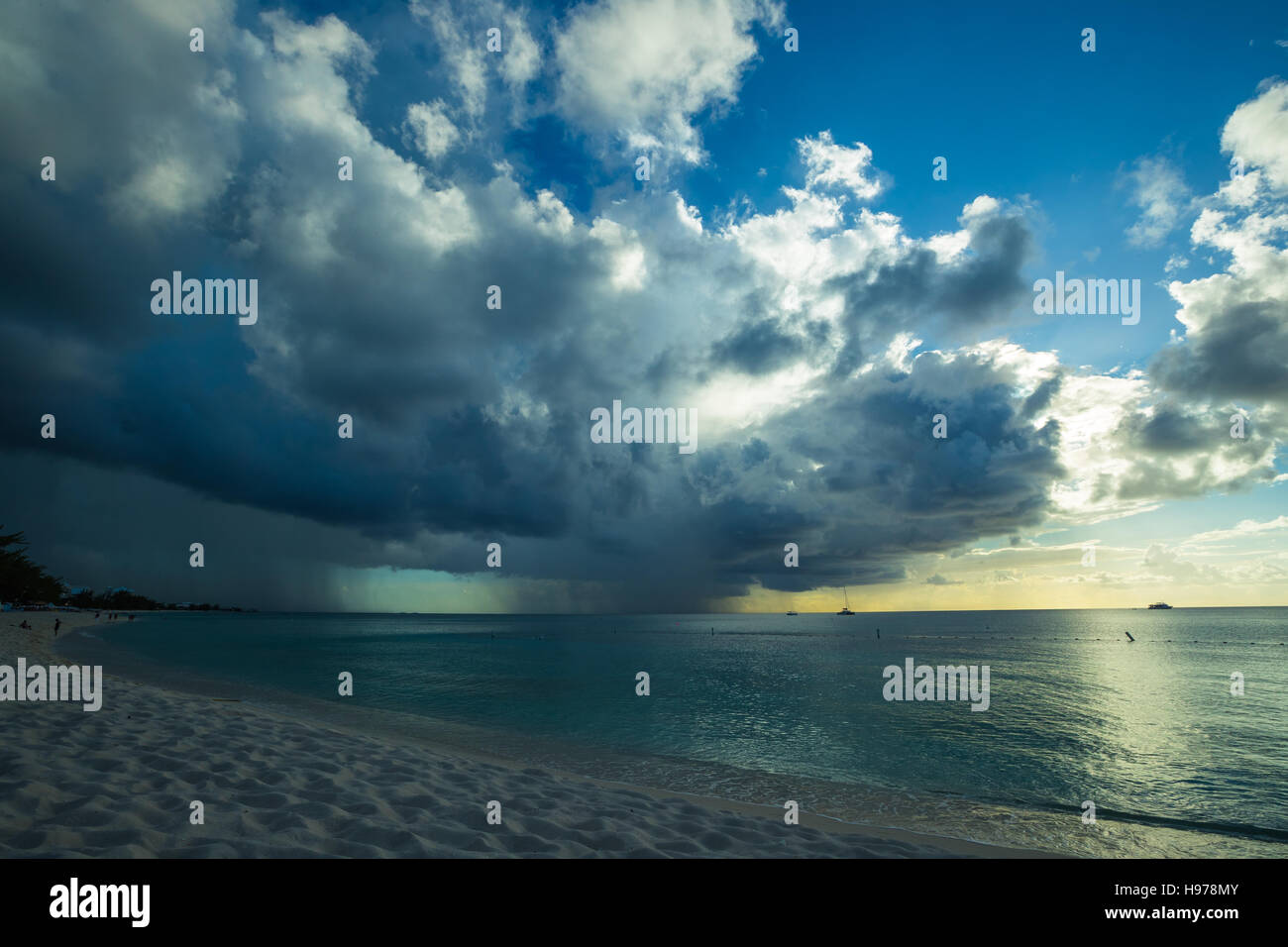 sunset over a tropical sea with golden sky and clouds Stock Photo - Alamy