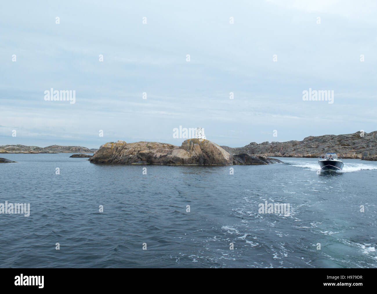 one fast motor boat on sweden westcoast between the rocks Stock Photo ...
