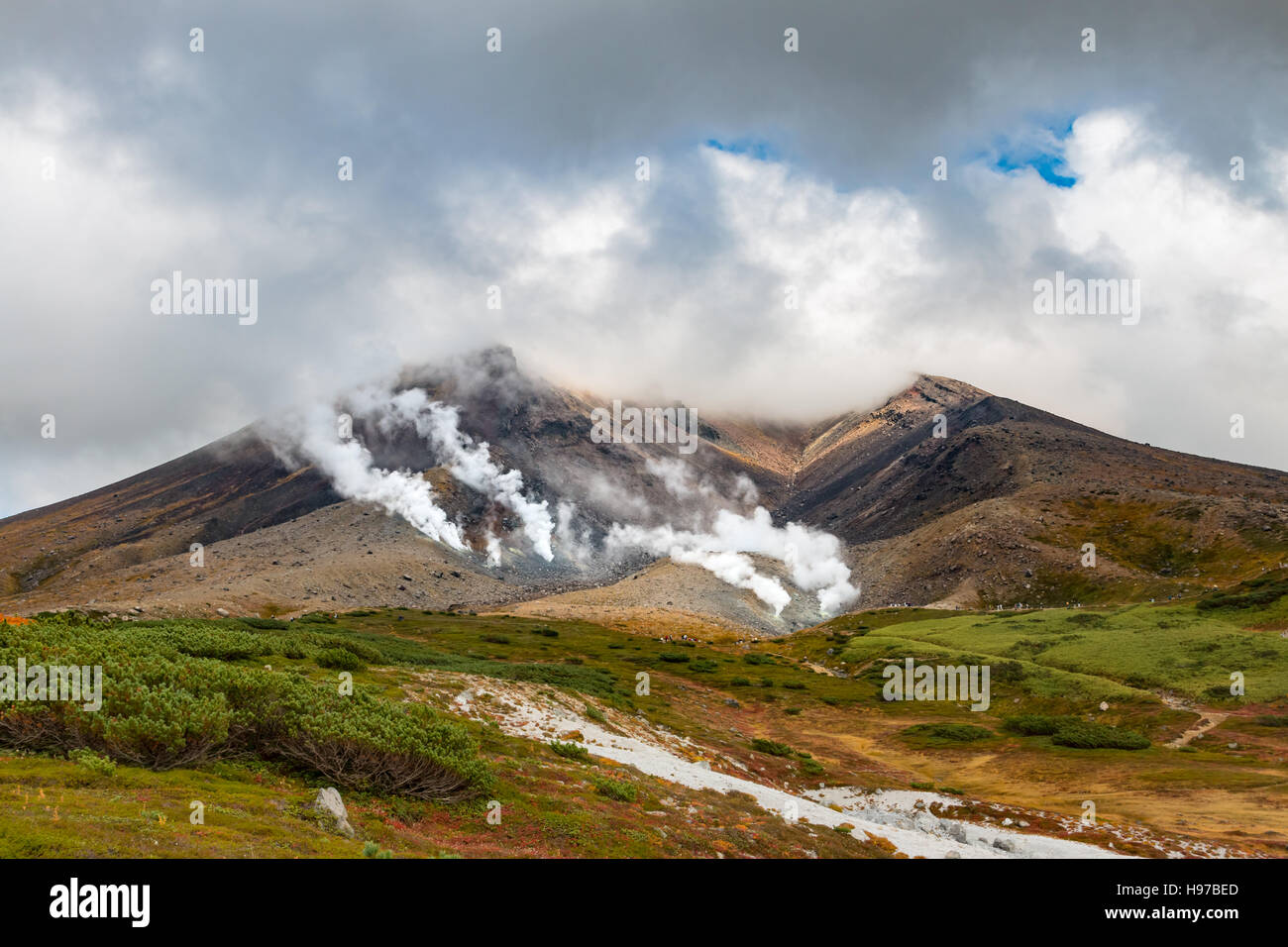 Smoke pours out of the fumaroles at the Mt. Asahidake volcano in Daisetsuzan National Park, Hokkaido, Japan in the fall Stock Photo