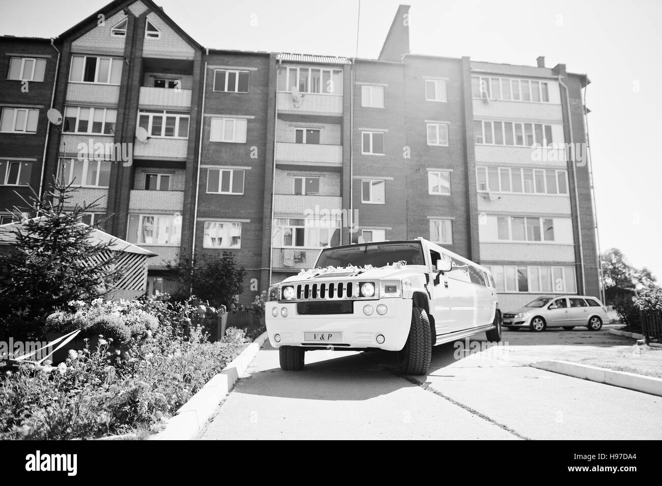 Kyiv, Ukraine - August 31: Elegance white wedding limousine Hummer H2 on wedding day. Black and white photo Stock Photo