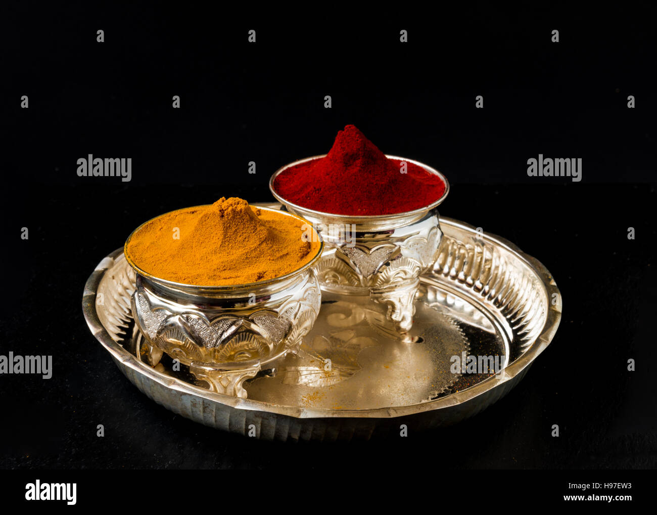 Turmeric and kumkum Powder in silverware Stock Photo