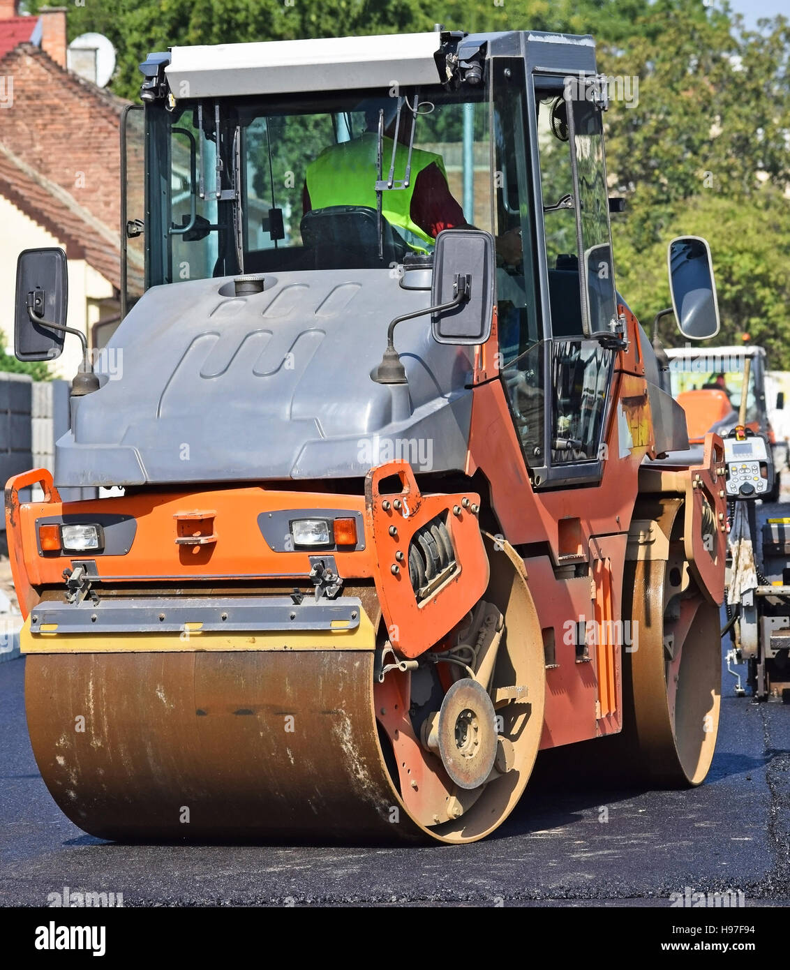 Steamroller at the road construction in the city Stock Photo