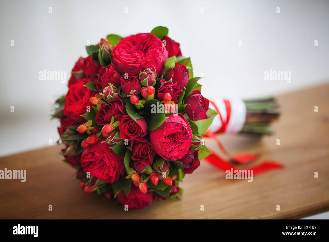 Wedding bridal bouquet of big red roses Stock Photo